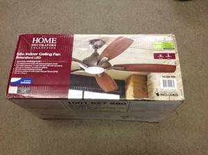 lot 33 image: Home Decorators Collection Petersford 52 in. Integrated LED Indoor Oil Rubbed Bronze Ceiling Fan with Light Kit and Remote Control not used