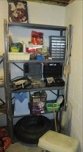 Metal shelf full of household items...