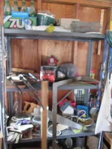 Shelf full of garage goodies includ...