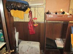 Clothing rack, Samsonite travel bag...