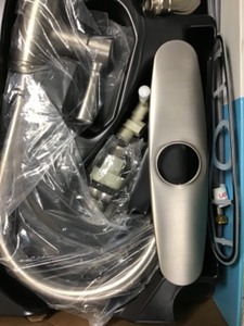 lot 70 image: Moen Noell Single-Handle Standard Kitchen Faucet with Side Sprayer in Spot Resist Stainless