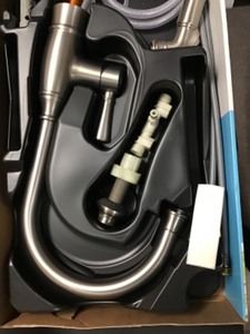 lot 71 image: Moen Noell Single-Handle Standard Kitchen Faucet with Side Sprayer in Spot Resist Stainless