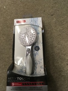 lot 135 image: Delta ActivTouch 9-Spray Hand Shower Model 75821CWC Chrome  White Finish