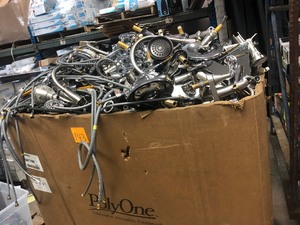 lot 143 image: Gaylord full of salvage branded faucets shower heads for parts or repair