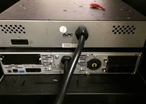 lot 66 image: MSRP $1100 Mobile Dell Server Rack with Components Pictured, APC UPS Computer Uninterruptible Power Supply by Schneider Electric, & WOW $$$$ 2 Dell N2024 Switches