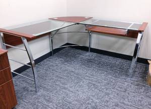 lot 19 image: Gorgeous Contemporary Cherry Finish Glass Chrome Corner Workstation With Thick Heavy Duty Tempered Glass Which Makes This Desk Planted Wherever You Place It Slide Out Keyboard Tray Included - Electronics Etc. Not Included - Like New Condition