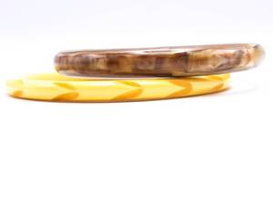 lot 56 image: (2) Vintage Bakelite Carved Bangles, Pair of Bracelets, 1940s