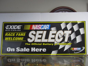 lot 55 image: Large Embossed Metal NASCAR Exide Batteries Advertising Sign