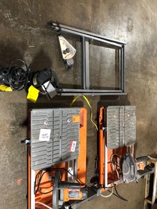 lot 12 image: LOT OF 2 RIDGID  9 Amp Corded 7 in. Wet Tile Saw used in working condition but missing parts aldo includes Submersible Sump Pump used not tested
