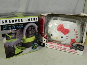 lot 46 image: Hello Kitty Toaster and Sharper Image Auto Vac