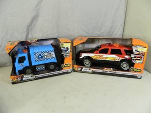 lot 62 image: 2 New Road Rippers Toy Trucks