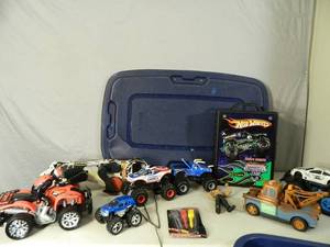 lot 132 image: Large Tote with Lid Full of Monster Trucks, Toys, and More