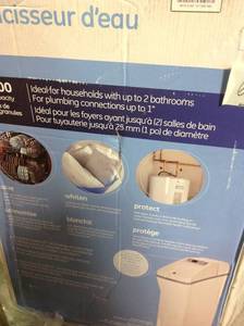 lot 62 image: GE 30,000 Grain Water Softener damaged cover see pictures not used