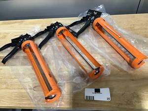 lot 25 image: JES Lot of three 1 Qt. 121 Caulk Guns