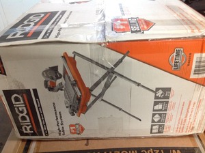 lot 108 image: RIDGID 9 Amp Corded 7 in. Wet Tile Saw with Stand in working conditions