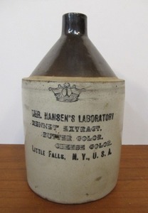 lot 109 image: Antique Hansens Laboratory Rennet Extract 1 Gallon Stoneware Advertising Jug