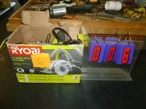 lot 6 image: Ryobi 4 Hand Held Tile Saw. As shown. SEE TERMS