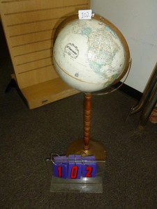 lot 102 image: 12 Globe on stand. As shown. SEE TERMS