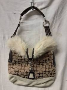 lot 27 image: Coach Brown Signature Handbag With Suede & Fur Trim