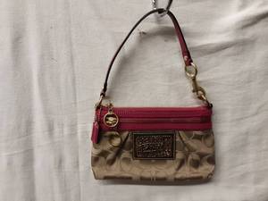 lot 45 image: Coach GoldHot Pink Wristlet