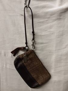 lot 52 image: Coach Brown Signature Wristlet With Tassel
