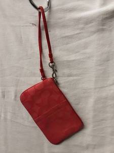 lot 54 image: Coach Tomato Red Signature Wristlet