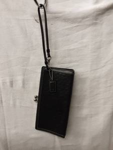 lot 63 image: Coach Black Leather Clutch With Strap