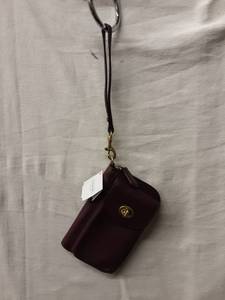 lot 67 image: Coach (New With Tags) Bordeaux Leather Zip Wallet With Strap