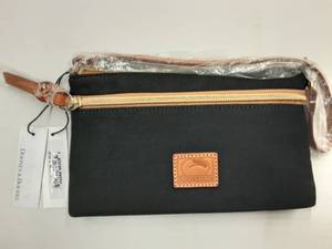 lot 84 image: Dooney & Bourke (New With Tags) Black Zip Clutch With Strap