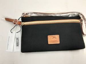 lot 86 image: Dooney & Bourke (New With Tags) Black Zip Clutch With Strap