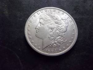 lot 7 image: 1884 O Morgan Silver Dollar