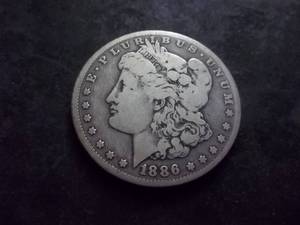 lot 11 image: 1886 O Morgan Silver Dollar