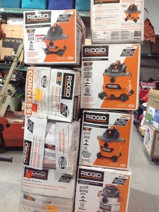 lot 16 image: Pallet of assorted Ridgid Vacuums different sizes some may need repair or have missing pieces