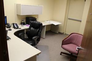 lot 126 image: L-Shape Office Desk, Wood Bookcase, Rolling Office Arm Chair, Over-Desk Cabinet, Whiteboard, Floor Protector