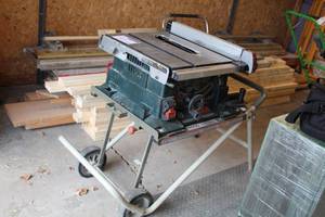 lot 215 image: Bosch Worksite 10in. Benchtop Table Saw 4000 with Ridgid Work-N-Haul It Two Wheel Work Stand