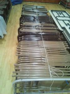 lot 7 image: Metal Folding Chairs (60) with rolling storage cart.