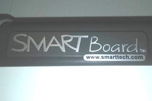 lot 112 image: Smartboard (65W x 49H) by smarttech.com  plus additional white Dry erase boards (16 ft. x 4 ft.)