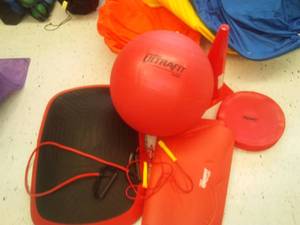 lot 752 image: Red Exerfit Rainbow exercise set. Includes mat ball, Balance Disc and more. Loc class rm 101