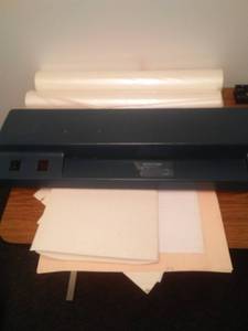 lot 777 image: Laminator Machine 18  feed, 2 large rolls of laminating plastic and more.  25 in. plastic. Loc Admin 110
