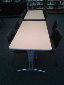 lot 631 image: 2 tables 8 Chairs. Each table is 5 ft. x 30 in. W x 35 in. H. Loc Rm 111 Lbry