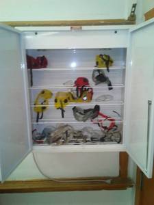 lot 635 image: Metal Cabinet with protective Eyewear, lighted with lock  no key. 24.5 W x 28T x 9 D. Sci Rm 99