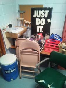 lot 562 image: Misc. Sports  training gear. Nike Shoes, Power Aide, crutches, chairs, tables  more. Loc Boys Sport Office
