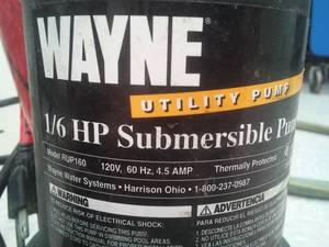 lot 317 image: 16 Hp Wayne bottom sump pump with hose, working condition. Submersible. Loc Kitchen