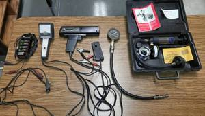 lot 216 image: Automotive, timing light, charging system analyzer, cooling pressure tester.