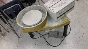 lot 431 image: pottery wheel, wedge tables chairs, clay and more