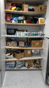 lot 435 image: Art room. Contents of cabinet shown. 200 pounds of grout  colored glazes and so much more