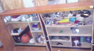 lot 698 image: Wood Cabinet and Contents  Toy Guns, wigs and more. 95 x 48 x 13in. Loc 3-Prop Rm
