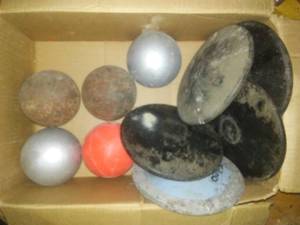 lot 726 image: Shot Puts (5) Discus (5). Loc 3-D Rm