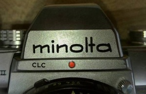 lot 694 image: 2 Minolta  35mm Cameras more. Loc Admin