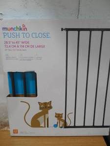 lot 87 image: Munchkin Push to Close Hardware Baby Gate, Extends 28.5 to 45 Wide, Dark Grey, Model MK0001